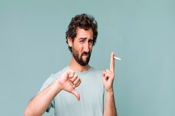 a man after a hair transplant showing that smoking is not a good idea