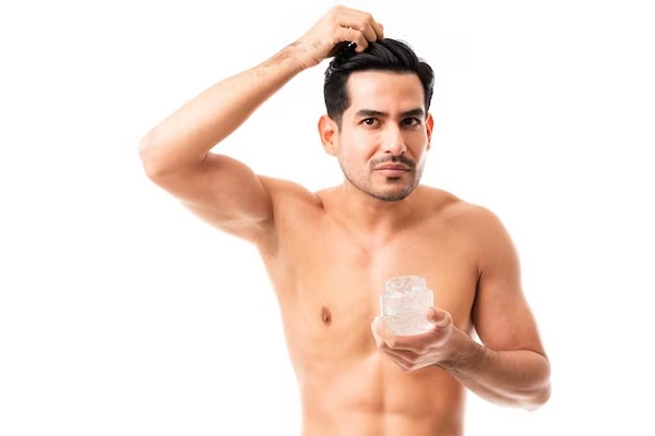 man putting gel after hair transplant
