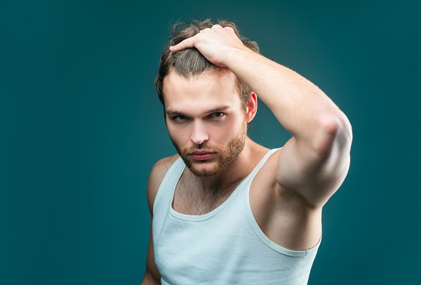 man shows his hair with confidence