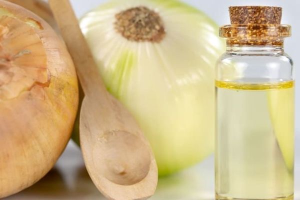 a bottle of onion juice for hair care