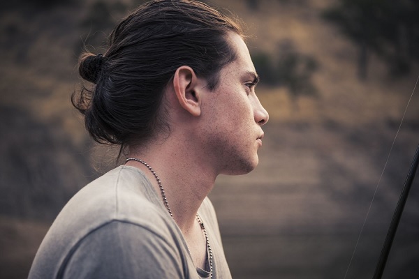 young boy with Long Haircuts like Man Bun
