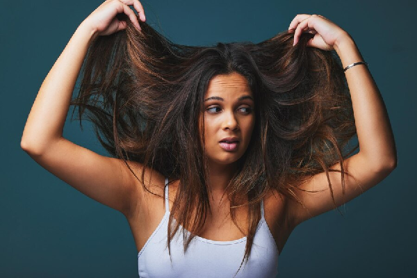 a woman showing her Hair Thinning