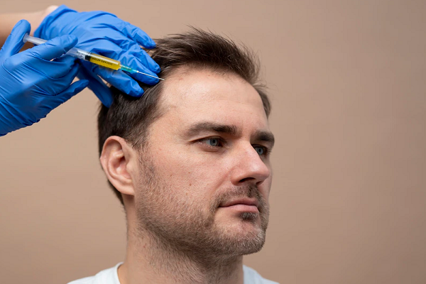 a man at the doctor's office while undergoing a PRP treatment