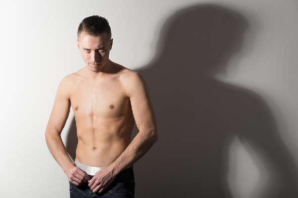 man with no shirt showing public hair