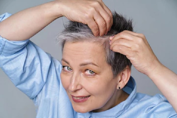 Senior woman with short hair and hands on head Polycystic Ovary Syndrome