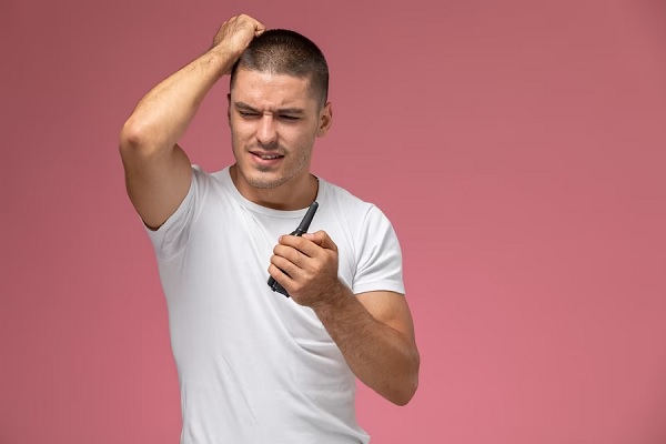 a man saying that the hair transplant hurt but its ok