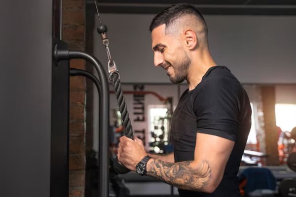 a man doing gym after a hair transplant