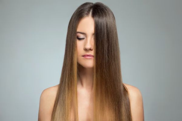 girl with long straight hair with closed eyes