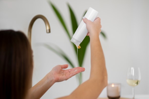 a woman in a shower using a Shampoo to Strengthen Hair