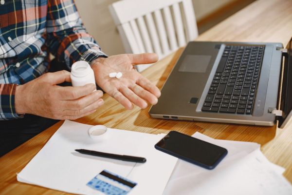 a hand of a man with jak inhibitors for alopecia areata pills