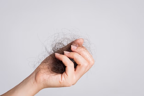 a hand with a fallen hair bun